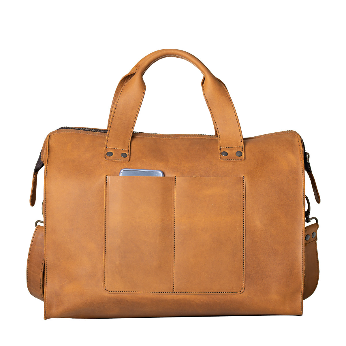 Simple Overnight Leather Duffle Bag in Tobacco, back view with exterior slip pockets holding a phone
