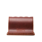 Pen Holder Bell Curve in Chestnut leather, empty front view showing the scalloped top and embossed Saddleback Leather Co. logo