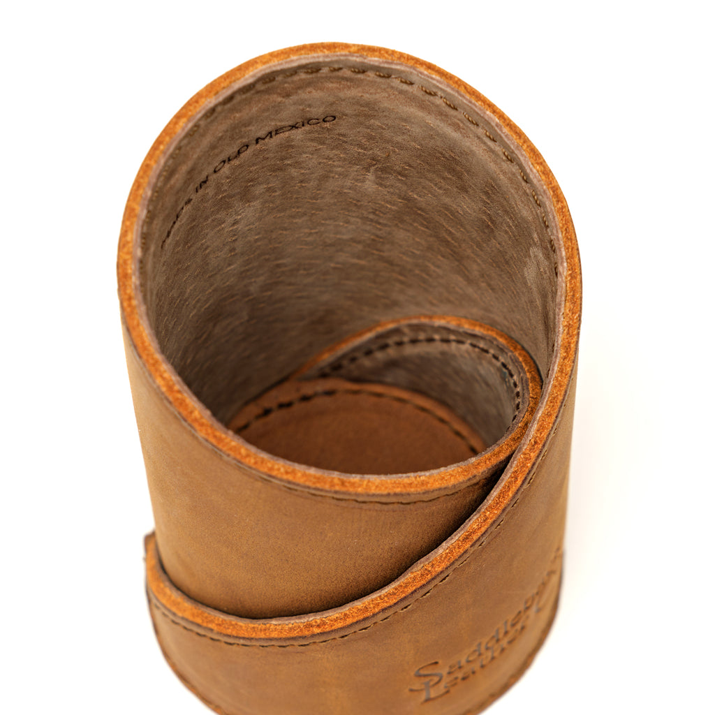 Pen Cup in Tobacco leather, close-up top view of the spiral wrap, stitched edges and suede interior