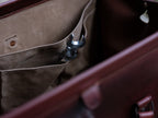 Leather Range and Tool Bag in Chestnut, close-up of an interior slip pocket holding a wrench