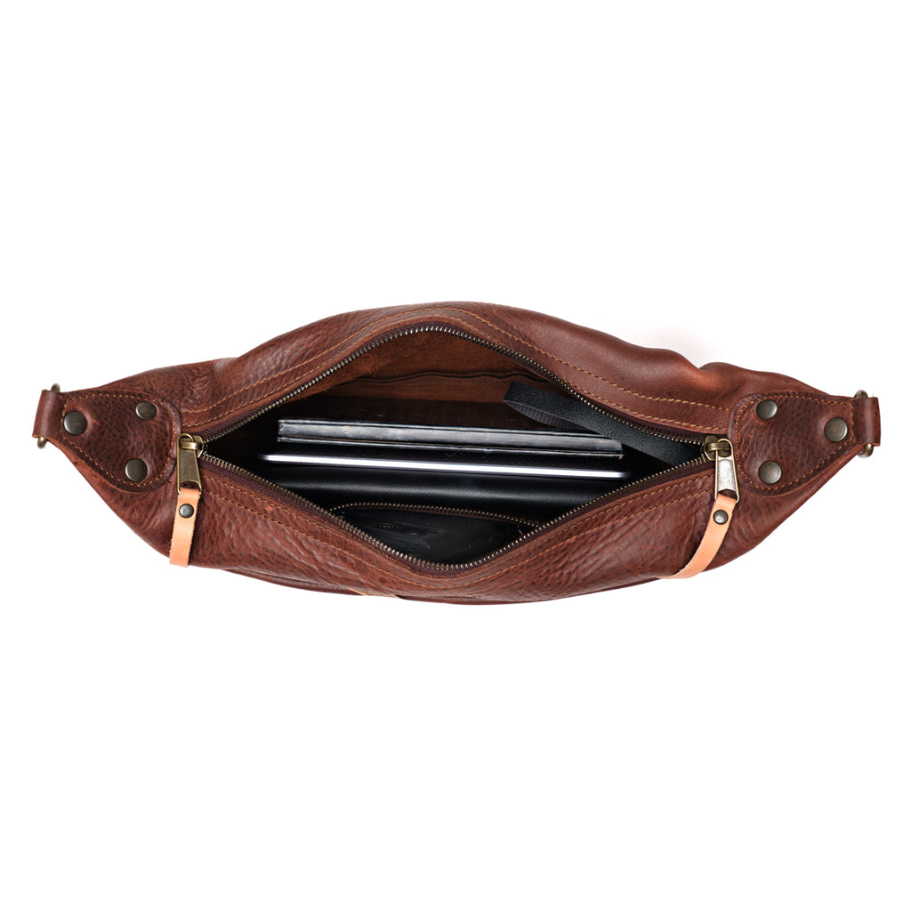 London Sling Small in Chestnut, top view unzipped with a phone and cards inside