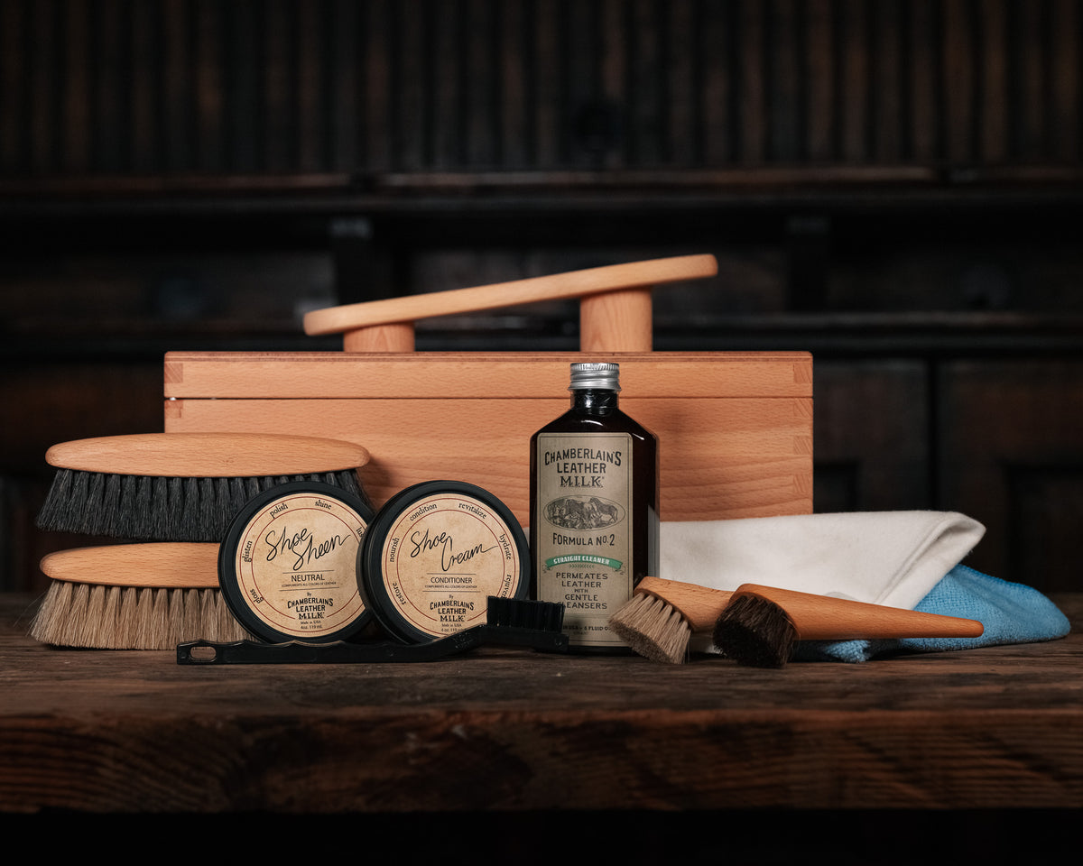 Luxury Shoe Shine Kit front view, wooden shine box with brushes, cream tins, leather care bottle, daubers and cloths