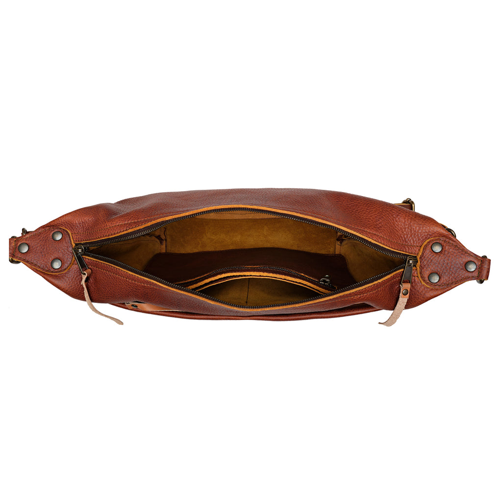 London Sling Large in Chestnut, top view unzipped showing the empty interior and slip pocket