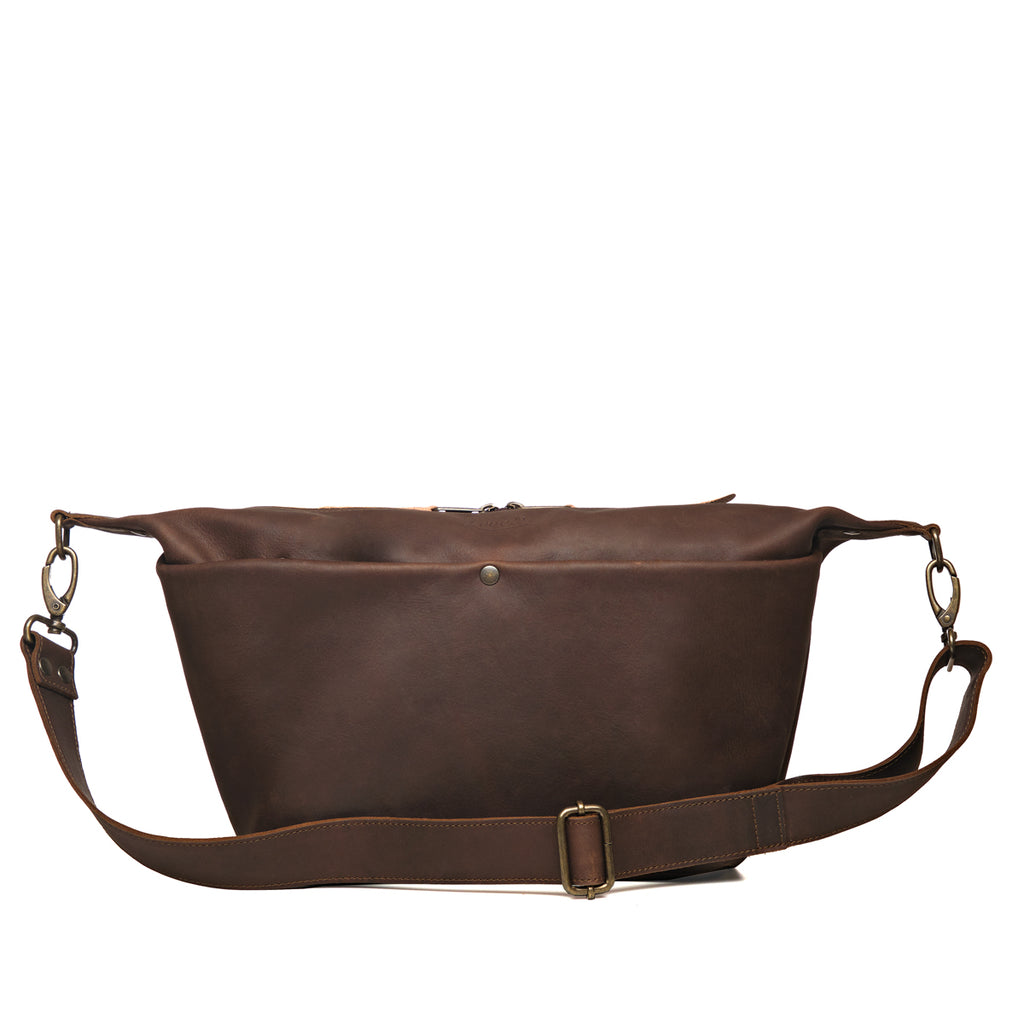 London Sling Large in Dark Coffee Brown, front view with snap pocket and buckled adjustable strap