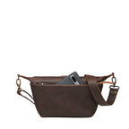 London Sling Small in Dark Coffee Brown, back view with a phone tucked in the rear slip pocket