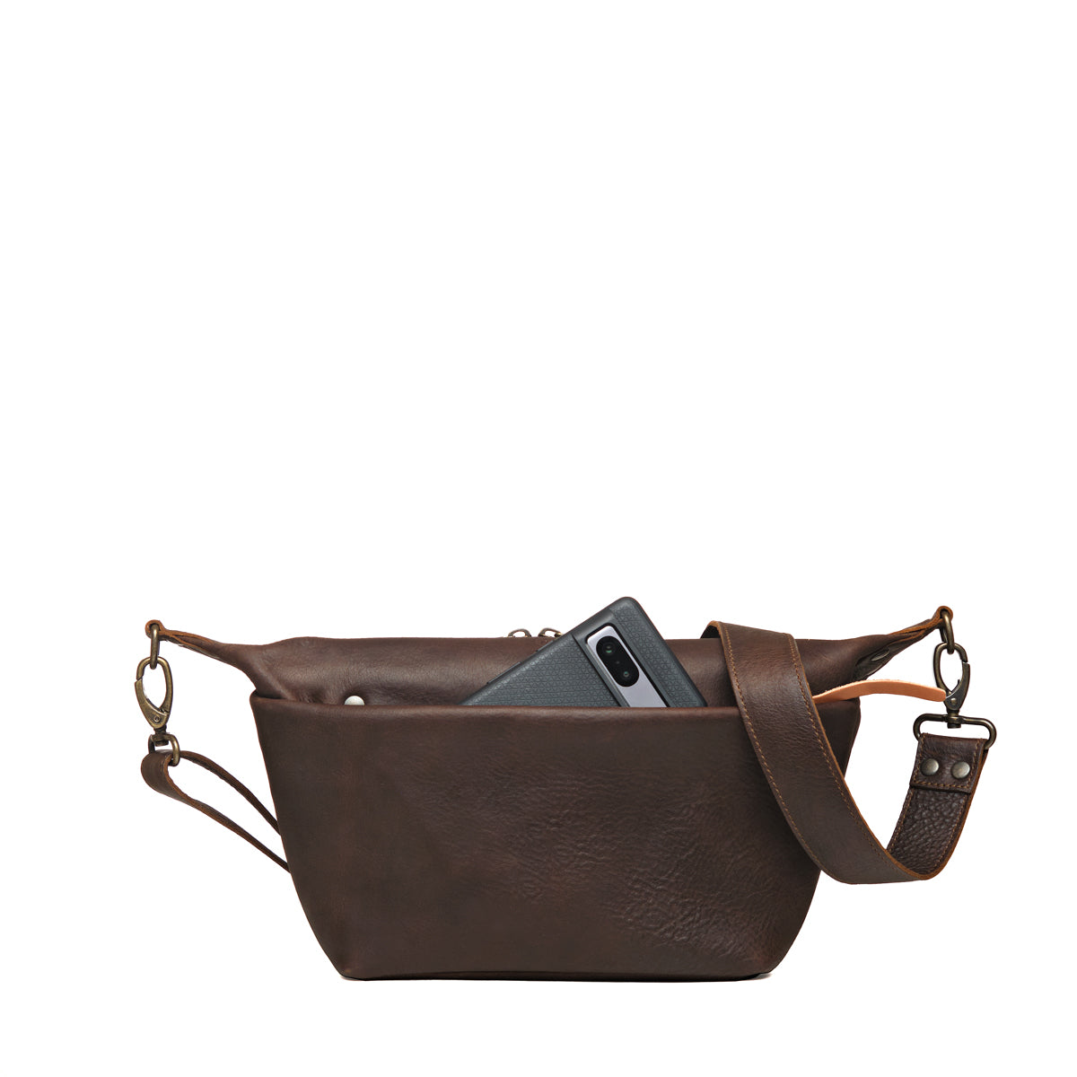 London Sling Small in Dark Coffee Brown, back view with a phone tucked in the rear slip pocket
