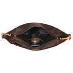 London Sling Small in Dark Coffee Brown, top view unzipped with a camera, lip balm and small pouch inside
