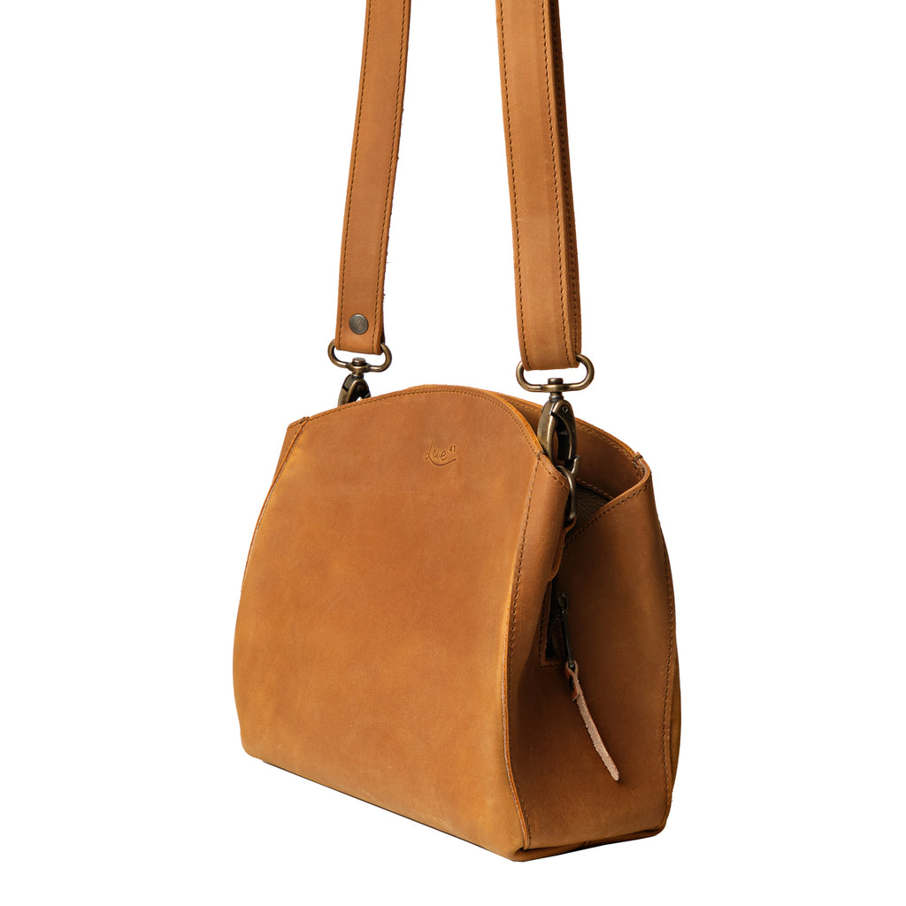 Leather Organizer Crossbody in Tobacco, angled side view showing the side zipper pull