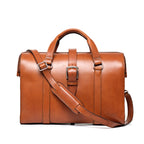 Spurgeon Briefcase in English Tan, front view with center buckle strap, top handles and shoulder strap