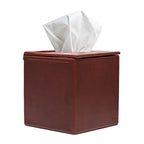 Tissue Box in Chestnut leather, front view with stitched seams and a tissue pulled from the top