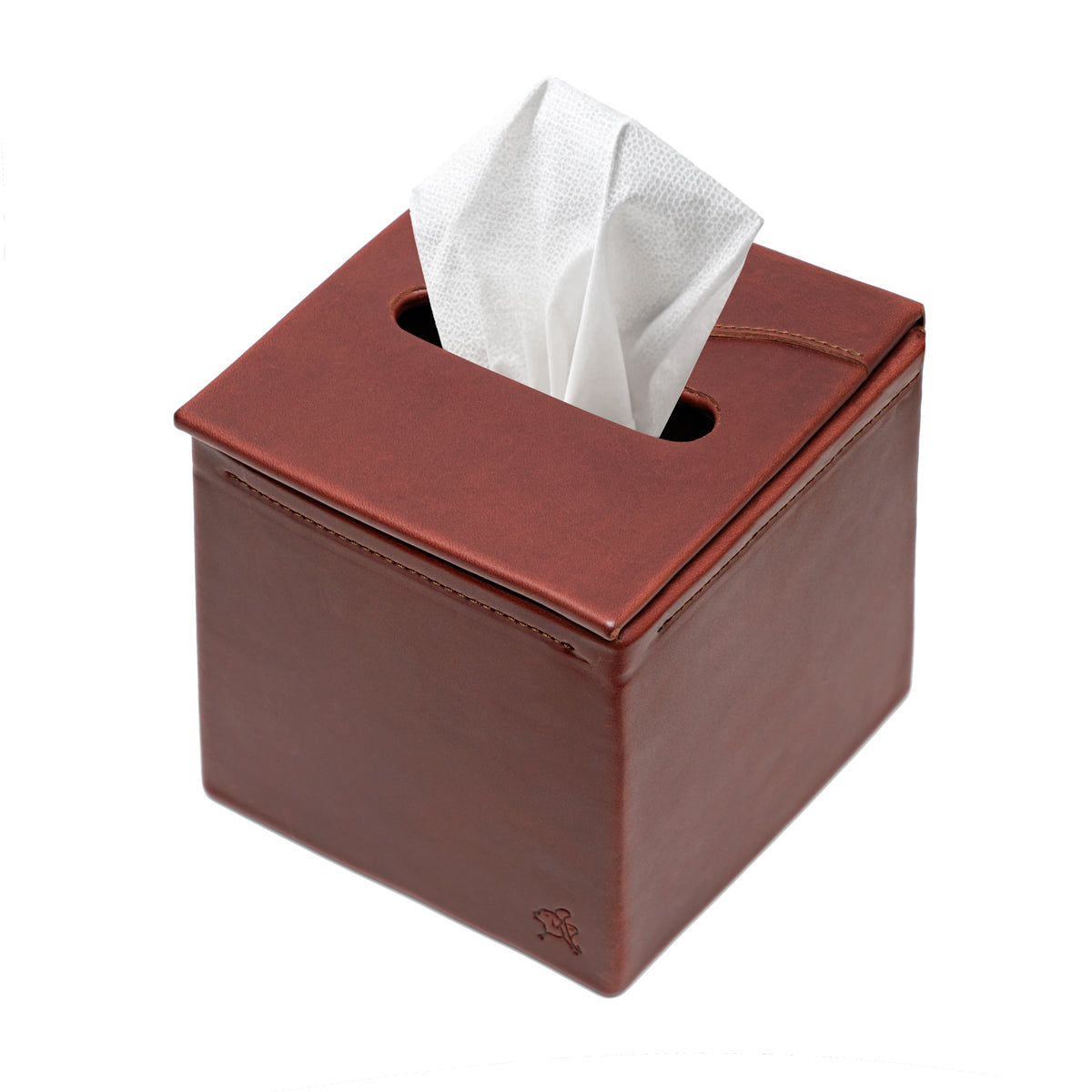 Tissue Box in Chestnut leather, top angled view with a tissue pulled through the slot