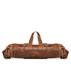 Large Travel Backpack in Burnt Sausage, rolled up and carried by top handle