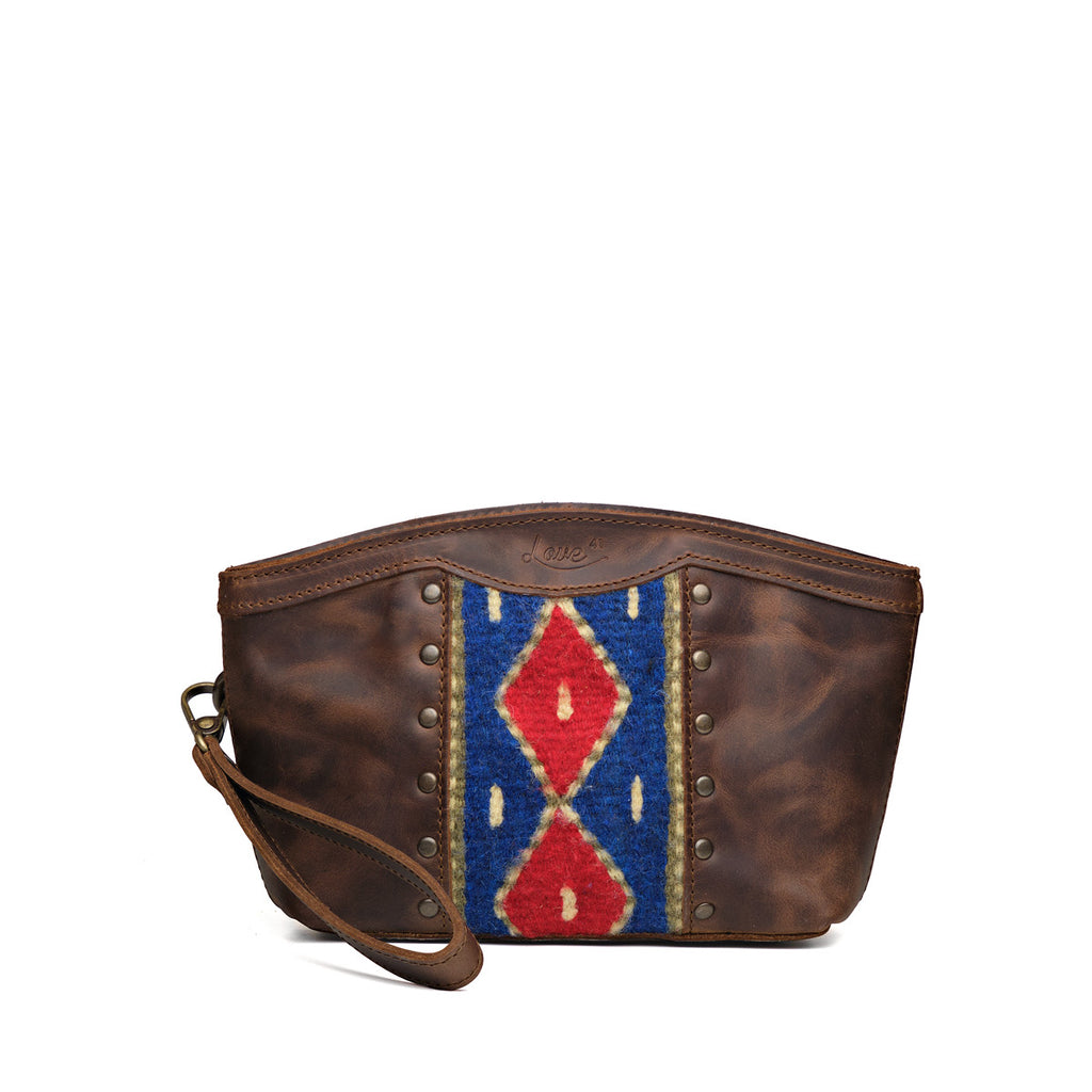 Lanita Leather Clutch in Dark Coffee Brown, front view with blue and red woven panel, studs and wrist strap
