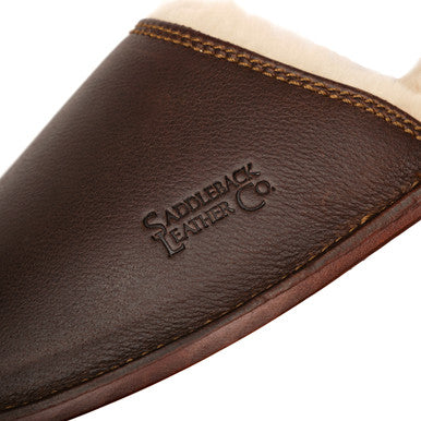Women's Sheepskin Slippers in Dark Coffee Brown, close-up of embossed Saddleback logo