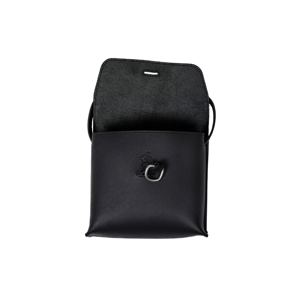 Leather Organizer Bag in Black with the flap lifted to show the metal ring and embossed logo