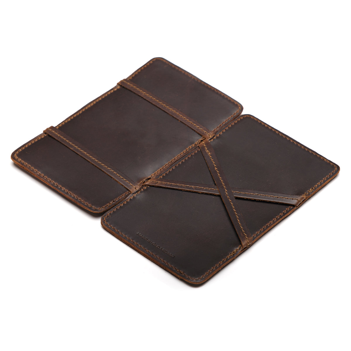 Large Magic Wallet in Dark Coffee Brown opened flat to show the crossed leather straps inside