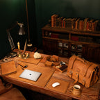 Leather Desk Pad New Design in Tobacco on a wooden desk with laptop, briefcase and accessories in a study