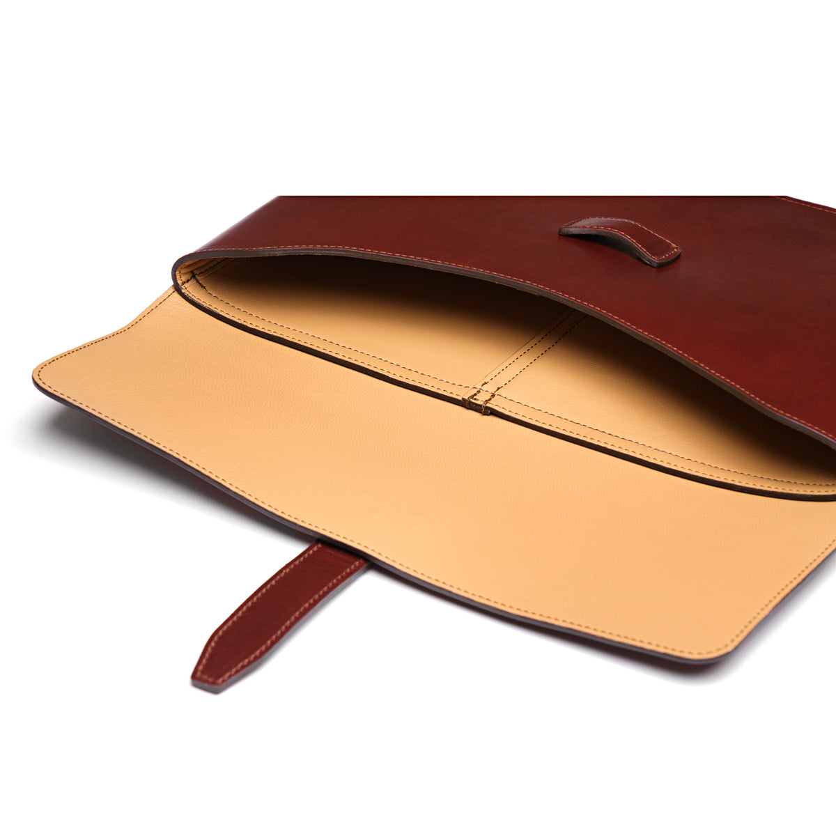 Silverback Document Holder in Oxblood, flap open showing the tan goatskin lining and tuck-in closure strap
