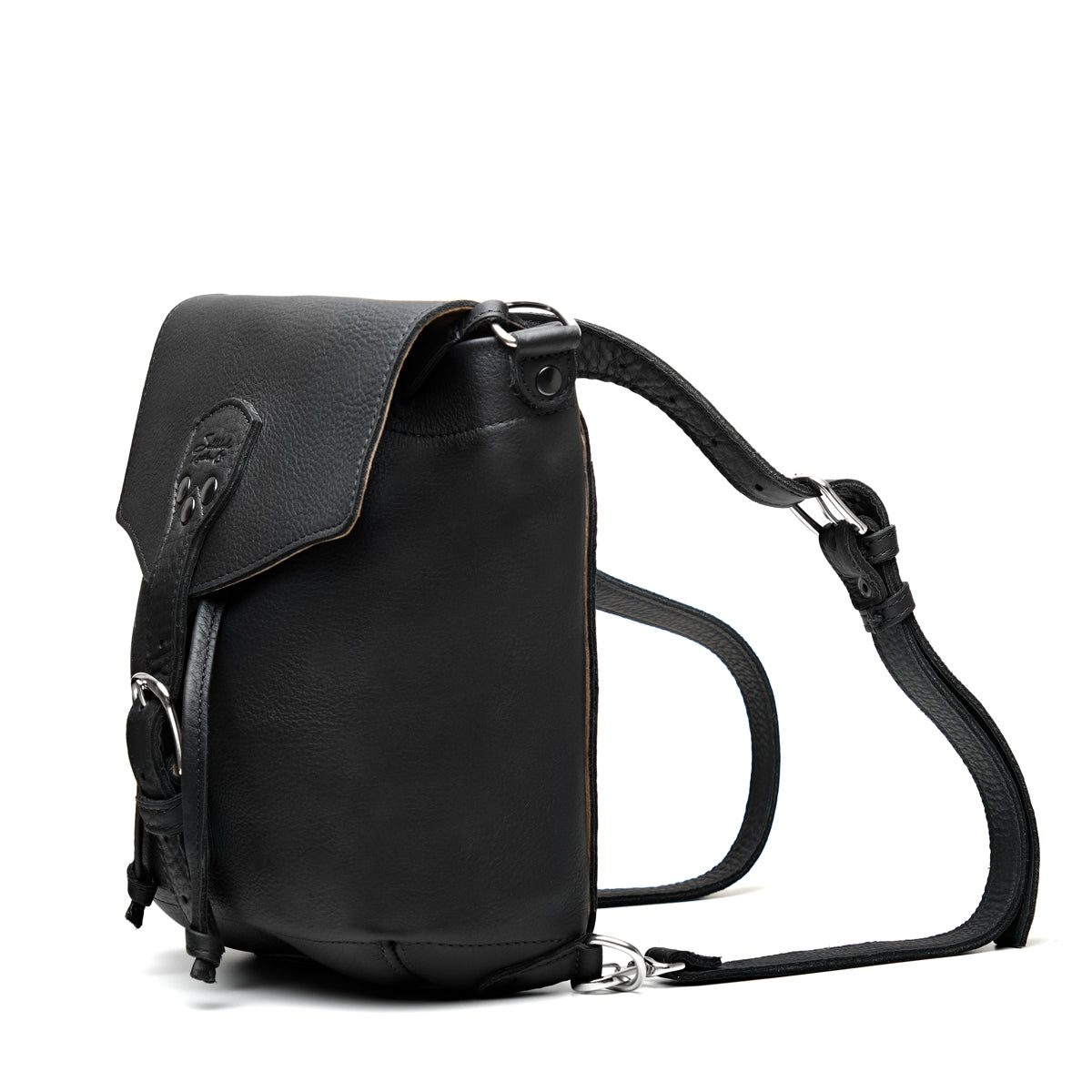 10" Convertible Crossbody in Black, angled view with buckled flap and straps set up as a backpack