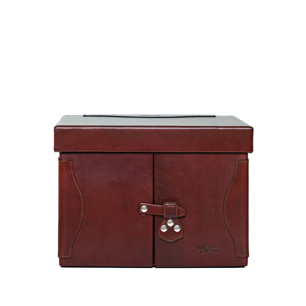 Churchill Case in Oxblood, closed front view showing the lid and latched double doors