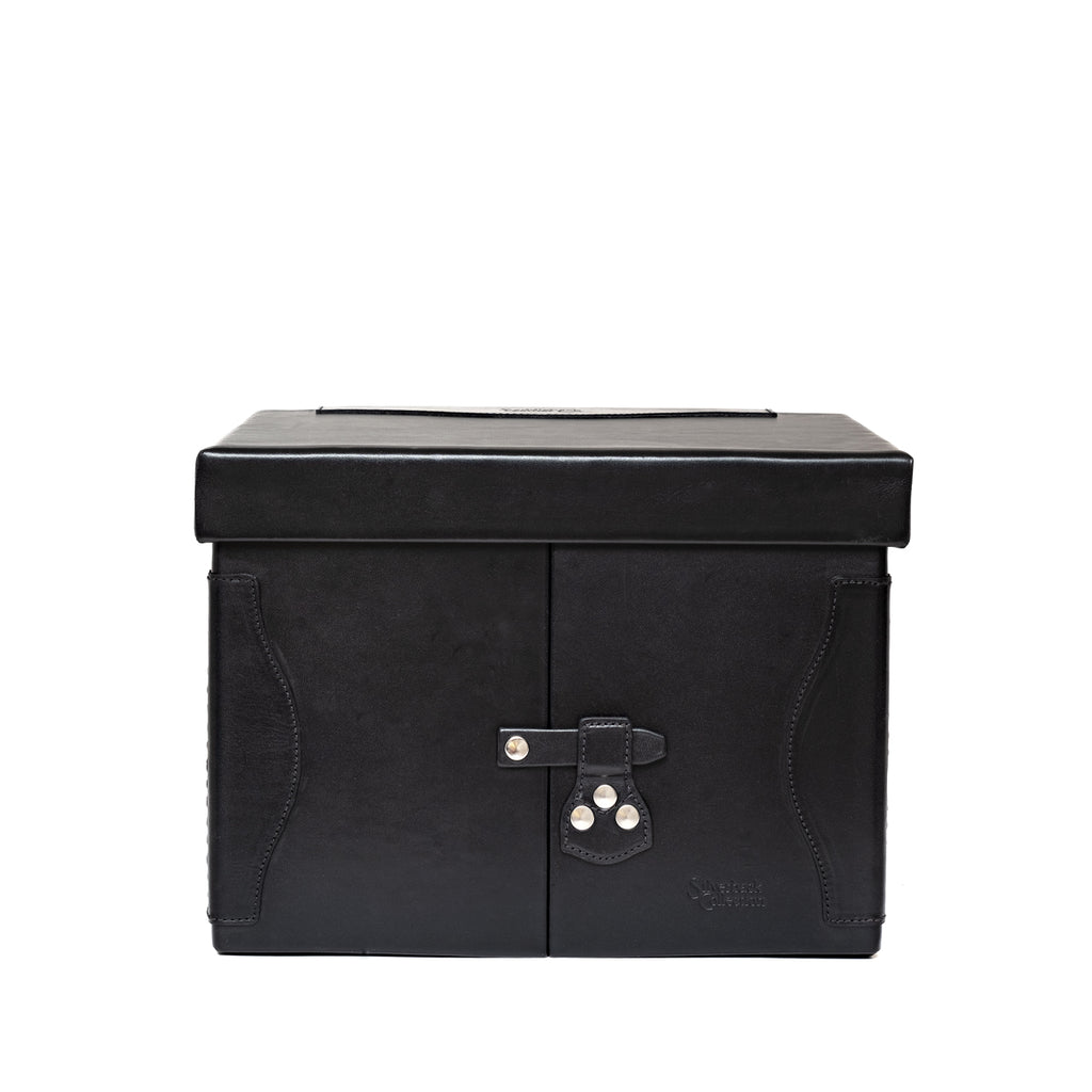 Churchill Case in Raven Black, closed front view showing the lid and latched double doors