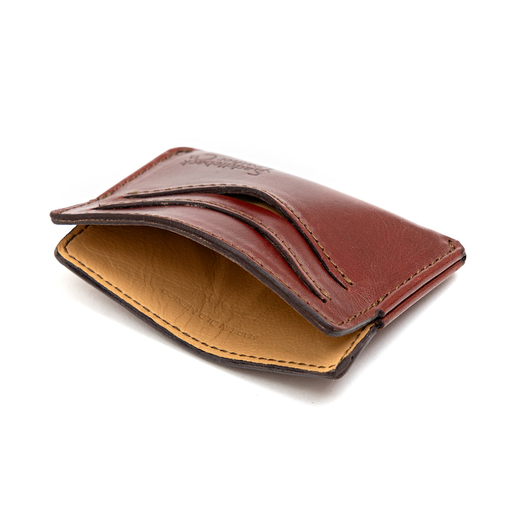 Newton Wallet in Oxblood, angled side view showing the tan interior and curved card slots