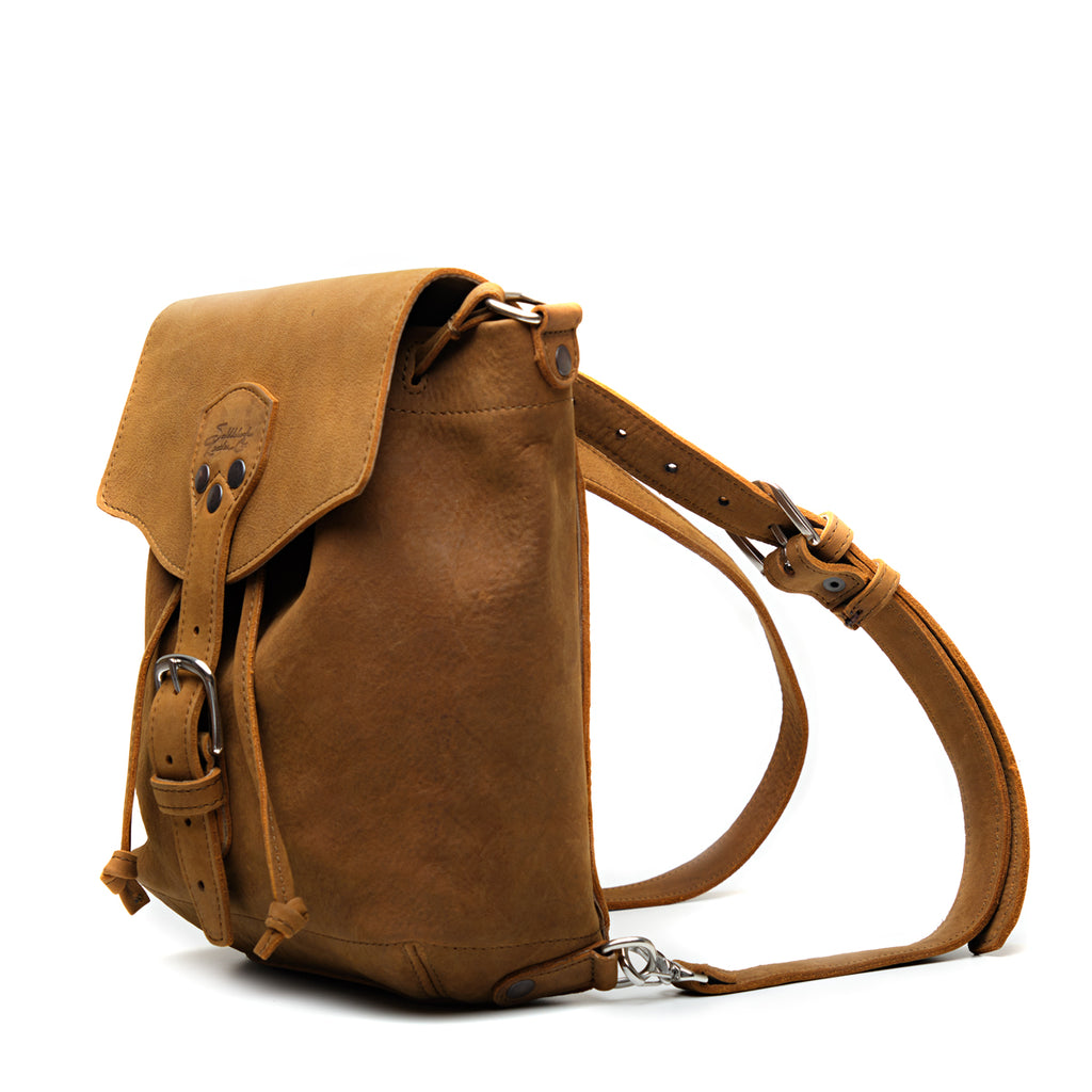 10" Convertible Crossbody in Tobacco, angled side view with straps set up as a backpack