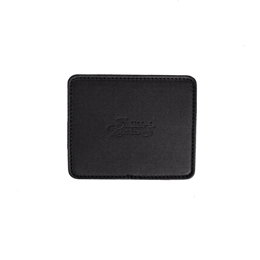 Leather Coaster Set in Black, single square coaster with embossed Saddleback logo, top view