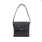Leather Organizer Bag in Black, front view hanging from its strap with flap and metal ring closure
