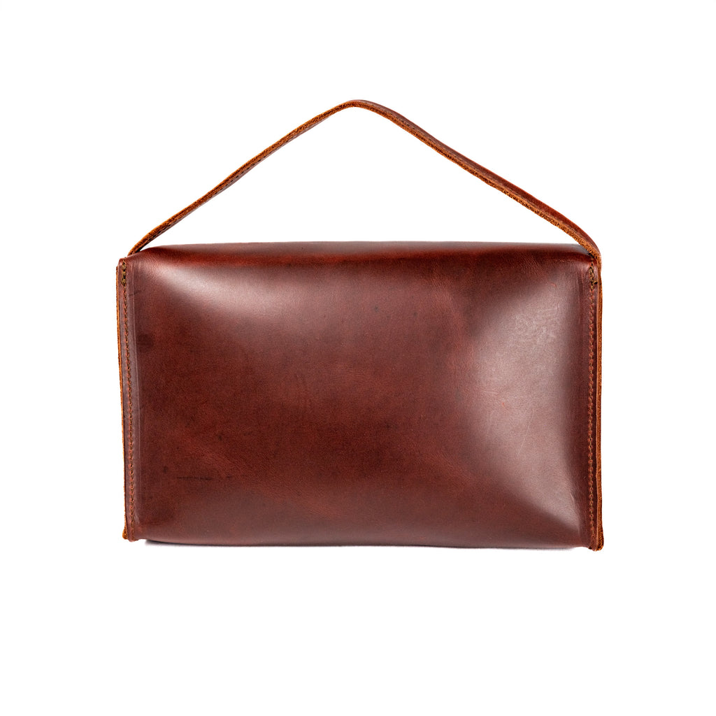 Large Leather Organizer Bag in Chestnut, back view with leather tie looped up as a carry handle