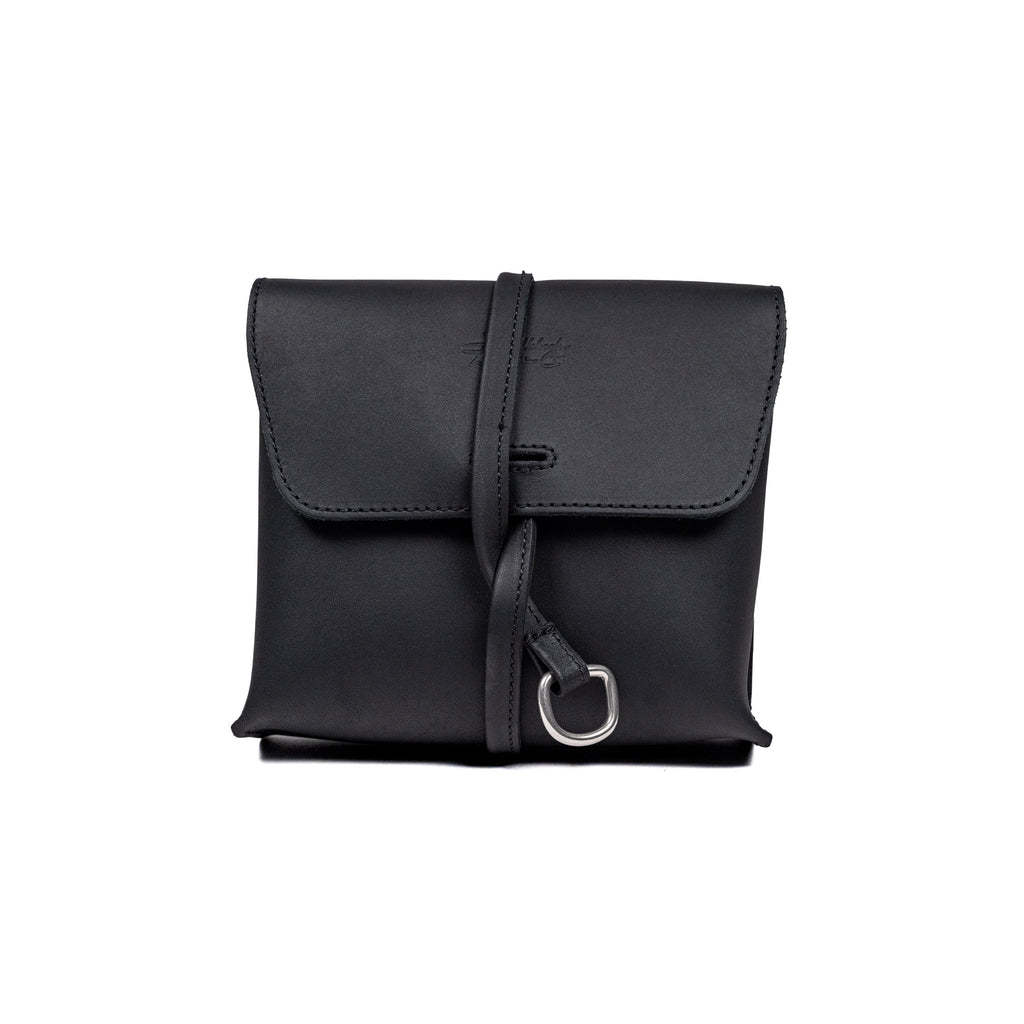 Leather Organizer Bag in Black, straight-on front view with flap closure and strap looped through a metal ring