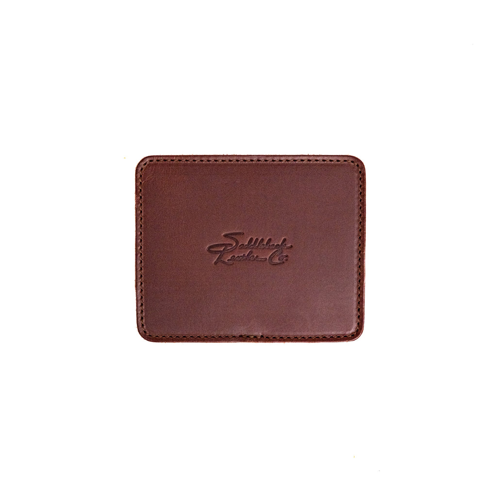 Leather Coaster Set in Chestnut, single square coaster with embossed Saddleback logo, top view