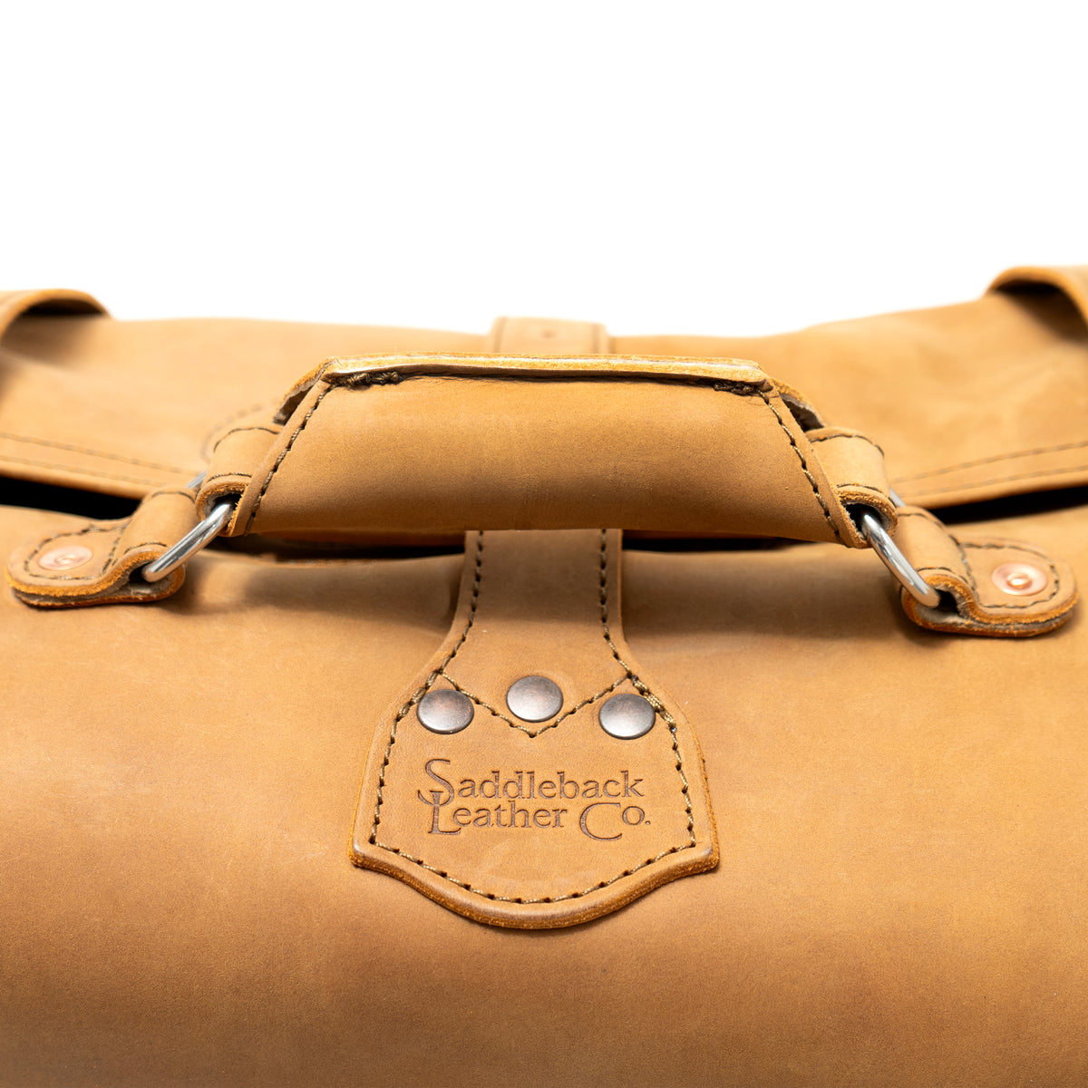 20" Waterbag in Tan, close-up of top handle and riveted Saddleback Leather Co. tab