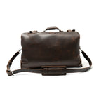 24" Waterbag in dark brown, back view with smooth panel, top handle and padded shoulder strap