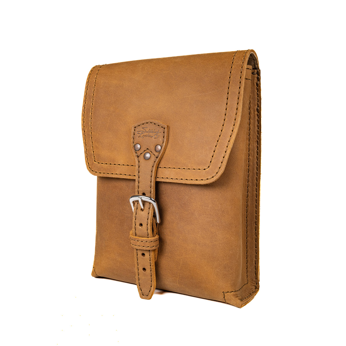 Leather Travel Satchel in Tobacco, angled front view with buckled strap closure on the flap