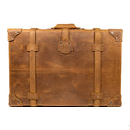 Grandfather Suitcase in Tobacco, back view with top handle, leather straps and riveted corners
