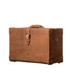 Grandfather Overnight Case in Tobacco, angled front view with top handle, buckled strap and metal corner caps