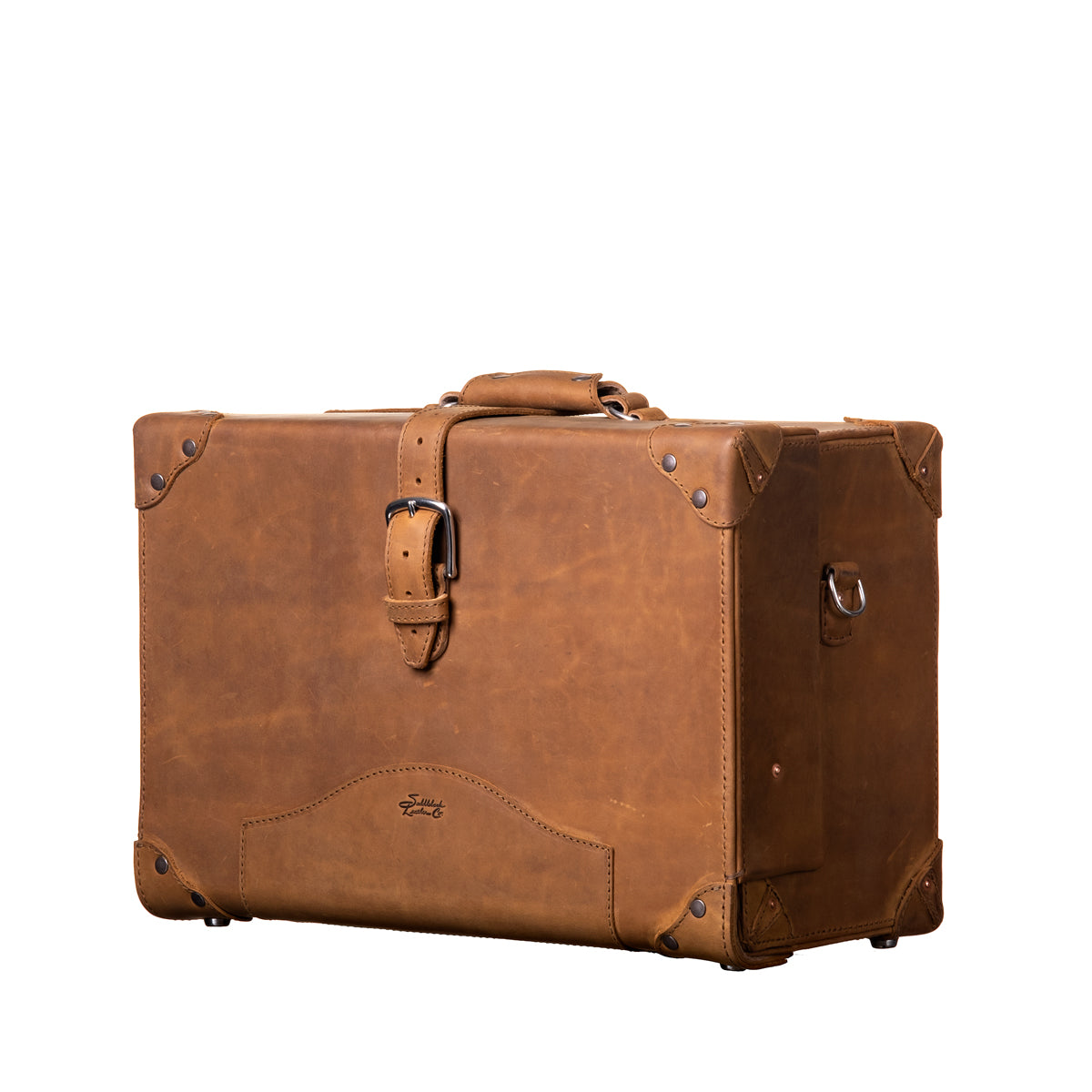 Grandfather Overnight Case in Tobacco, angled front view with top handle, buckled strap and metal corner caps