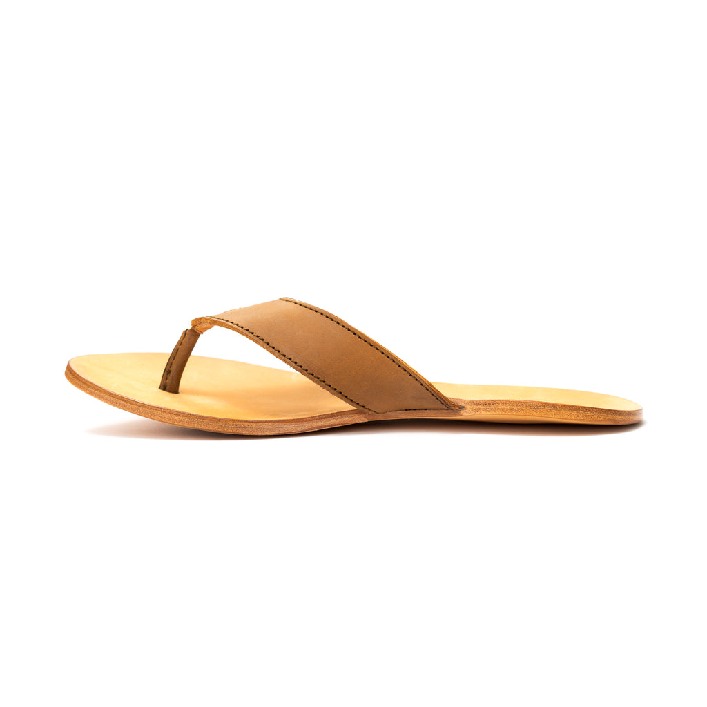 Single Flip Flop in Tobacco leather with natural footbed, side profile view