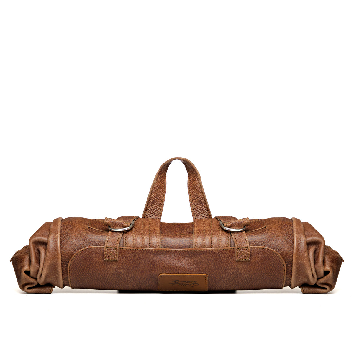 Large Travel Backpack in Burnt Sausage, rolled up with the top handle raised