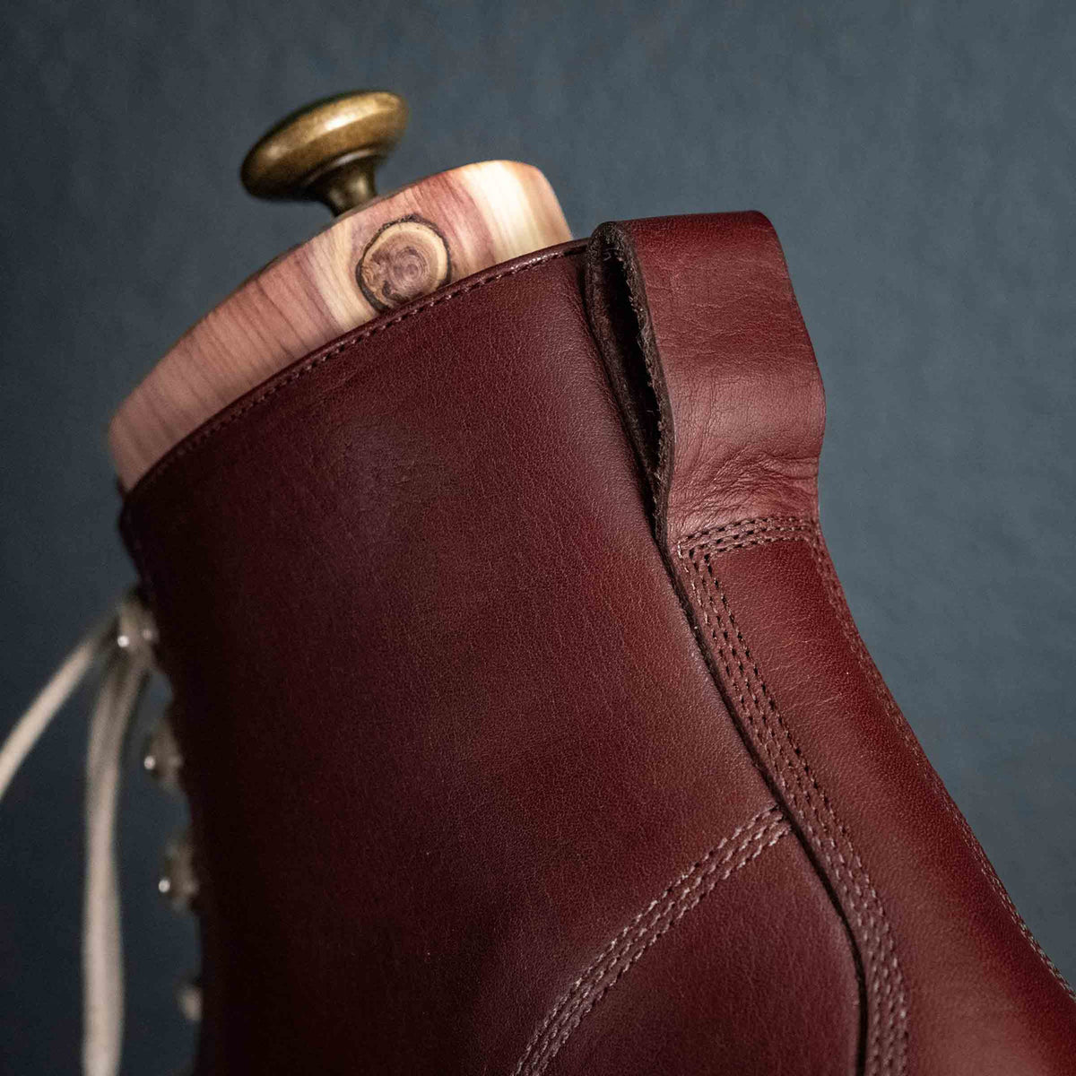 Officer Boot in Oxblood, close-up of shaft stitching and cedar boot tree