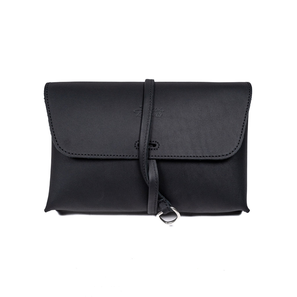 Large Leather Organizer Bag in Black, closed flap with wrapped leather tie and ring, front view