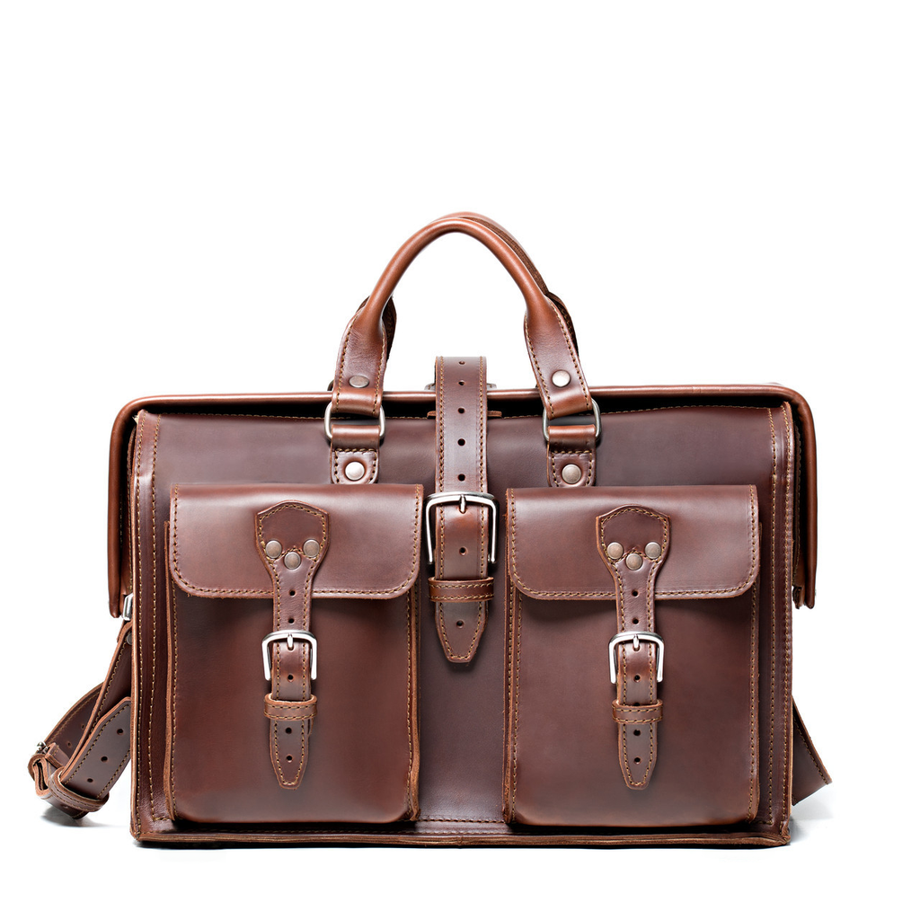 Barrister's Briefcase in Chestnut, front view with top handles, center buckle strap and two buckled front pockets