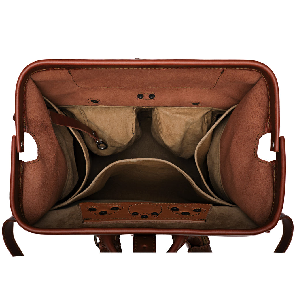 Big Mouth Leather Backpack in Chestnut, top view of the wide-open mouth showing interior pockets