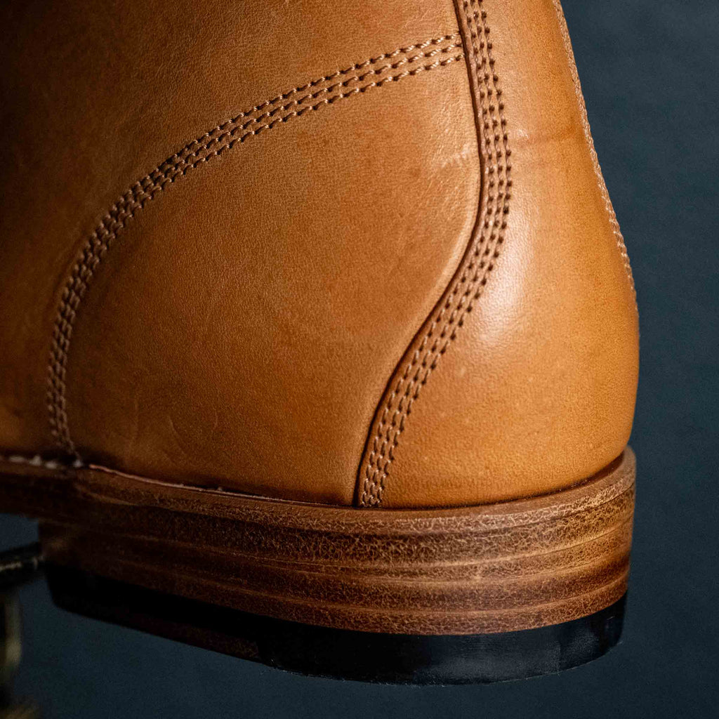 Officer's Boot in English Tan, close-up of the heel counter stitching and stacked leather heel