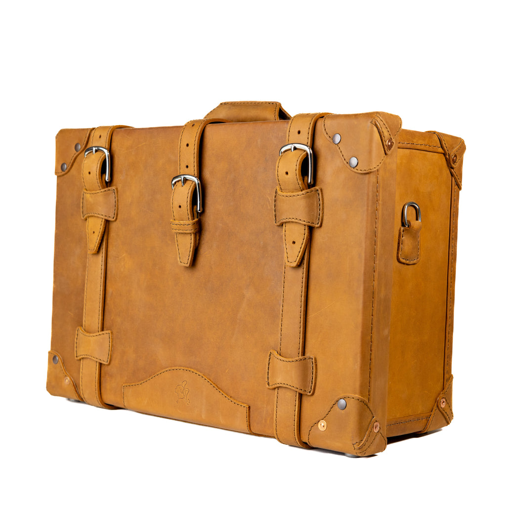 Grandfather Carry On in Tobacco, angled front view with buckle straps and side strap ring