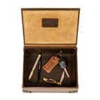 Leather Desk Box in Dark Coffee Brown, open top-down view with pens, a key on a leather keychain and a pocketknife inside