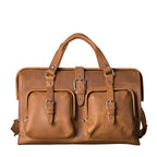 Deep Pocket Leather Duffle Bag in Tobacco, front view with two buckled pockets and center strap