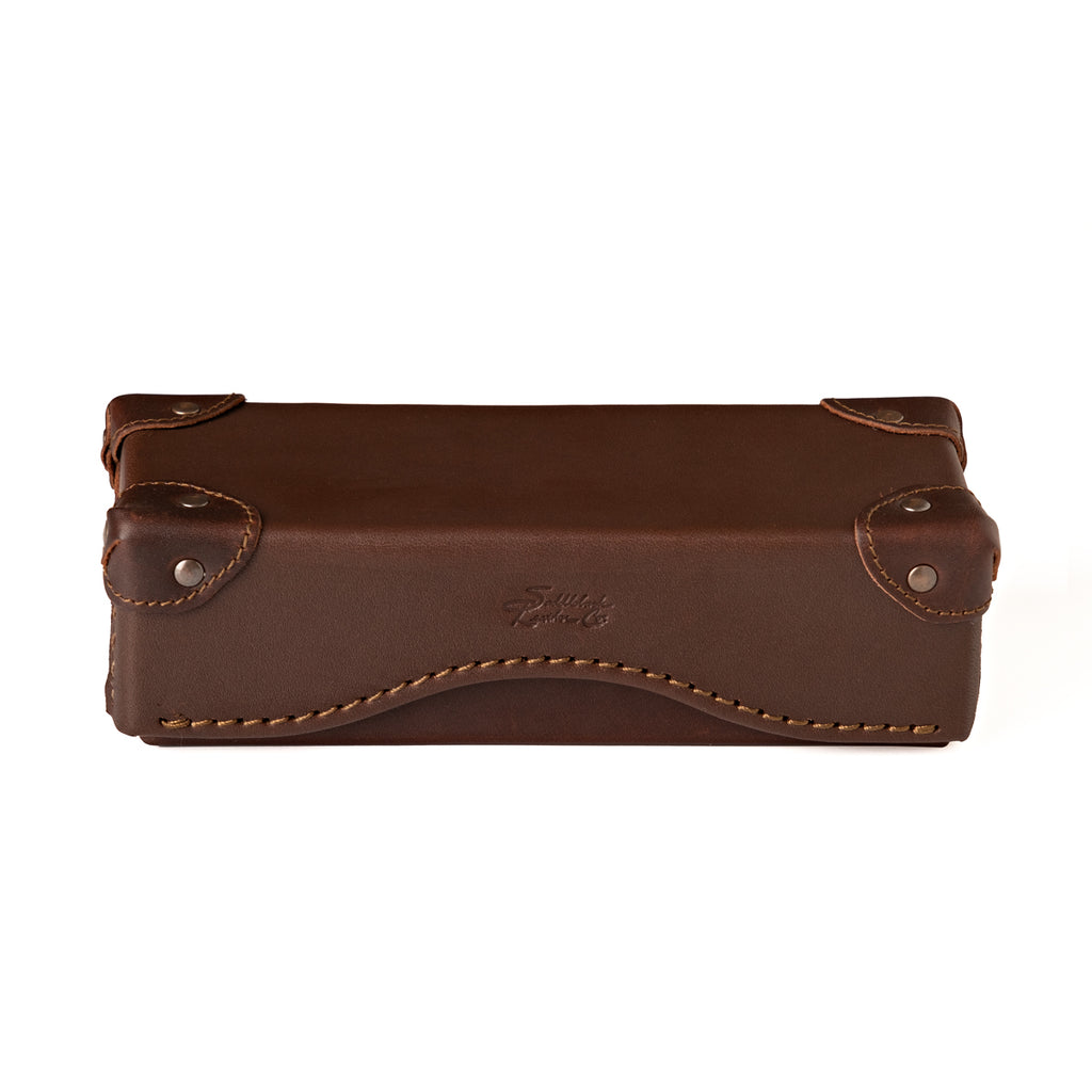 Grandfather Eyeglass Case in Chestnut leather, closed front view with riveted corner caps and embossed logo