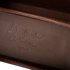 Grandfather Eyeglass Case in Chestnut leather, close-up of embossed Grandfather Collection script and edition number